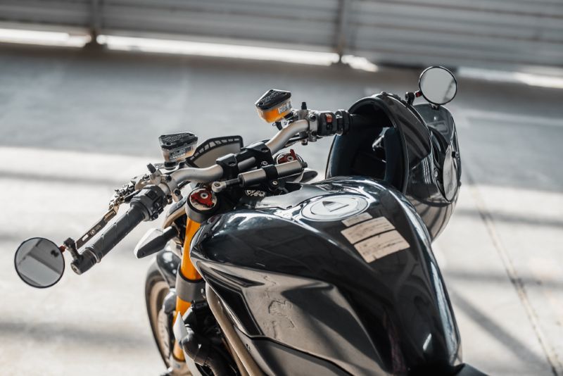 Black motorcycle stationary in a parking lot